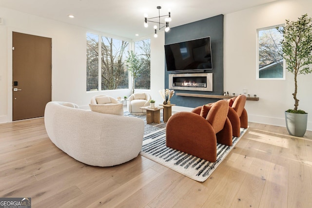 1045 Shepherds Ln NE, Atlanta, GA 30324 - living area featuring plenty of natural light, a chandelier, wood finished floors, and recessed lighting