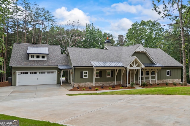 177 Hancock Way, Baldwin, GA 30511 - view of front facade featuring concrete driveway, a standing seam roof, roof with shingles, a metal roof, and a chimney
