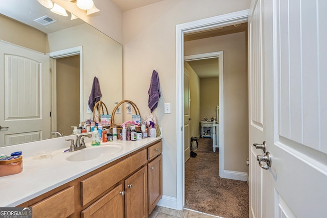 874 Crescent Ln Unit 52, Griffin, GA 30224 - bathroom with vanity and baseboards