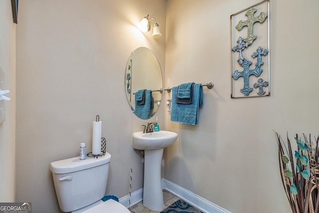 874 Crescent Ln Unit 52, Griffin, GA 30224 - half bath featuring toilet and tile patterned flooring
