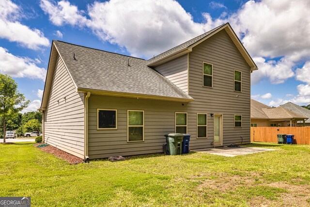 874 Crescent Ln Unit 52, Griffin, GA 30224 - rear view of property featuring a shingled roof and a patio