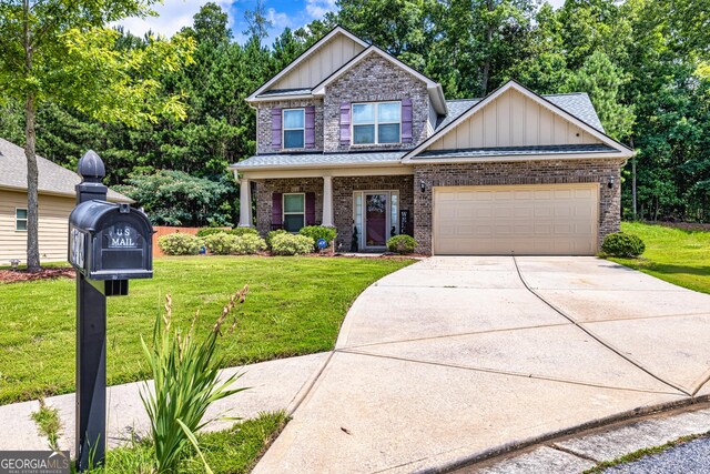 874 Crescent Ln Unit 52, Griffin, GA 30224 - craftsman inspired home with board and batten siding, an attached garage, a front yard, concrete driveway, and brick siding