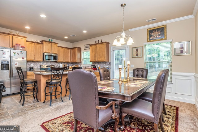 874 Crescent Ln Unit 52, Griffin, GA 30224 - dining area featuring a chandelier, ornamental molding, recessed lighting, and a wainscoted wall