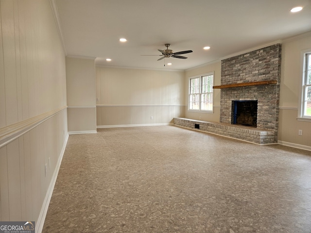 29 Jef Rd, Statesboro, GA 30458 - unfurnished living room with crown molding, ceiling fan, a brick fireplace, a decorative wall, and recessed lighting