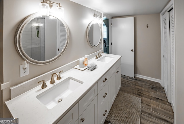 74 Hollis Hts, Newnan, GA 30263 - full bath with double vanity, a closet, and wood finished floors