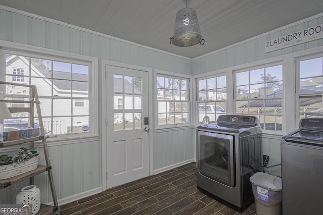 74 Hollis Hts, Newnan, GA 30263 - laundry room featuring washing machine and clothes dryer, dark wood-type flooring, and ornamental molding
