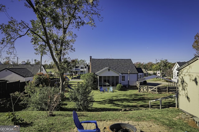 74 Hollis Hts, Newnan, GA 30263 - view of yard featuring a fire pit and a sunroom