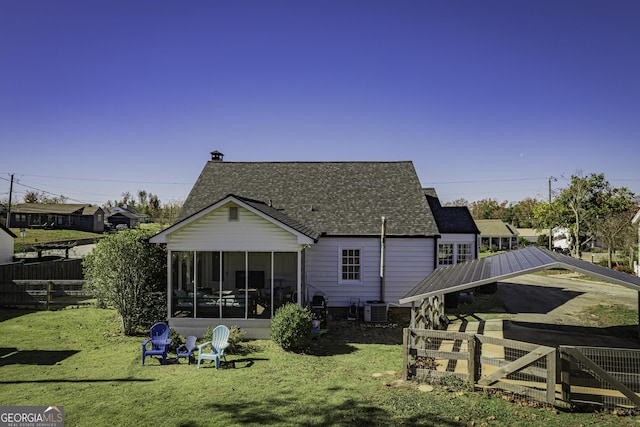 74 Hollis Hts, Newnan, GA 30263 - rear view of property featuring a shingled roof and a sunroom