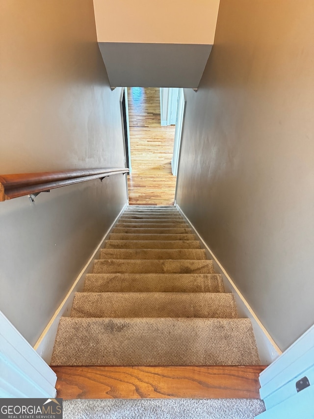 2640 Preston Ridge Ln, Dacula, GA 30019 - staircase with baseboards and wood finished floors