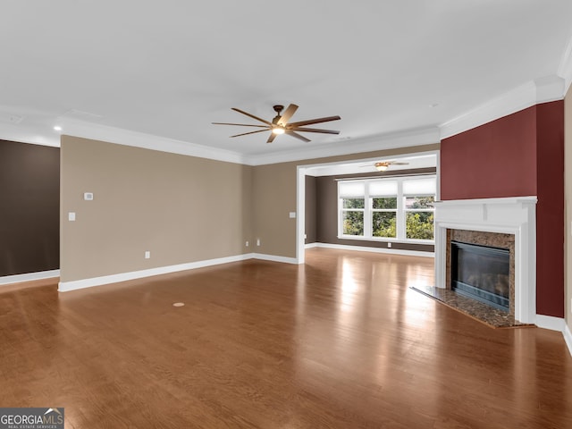 302 Burberry Ct, Griffin, GA 30223 - unfurnished living room featuring a ceiling fan, ornamental molding, wood finished floors, a high end fireplace, and baseboards