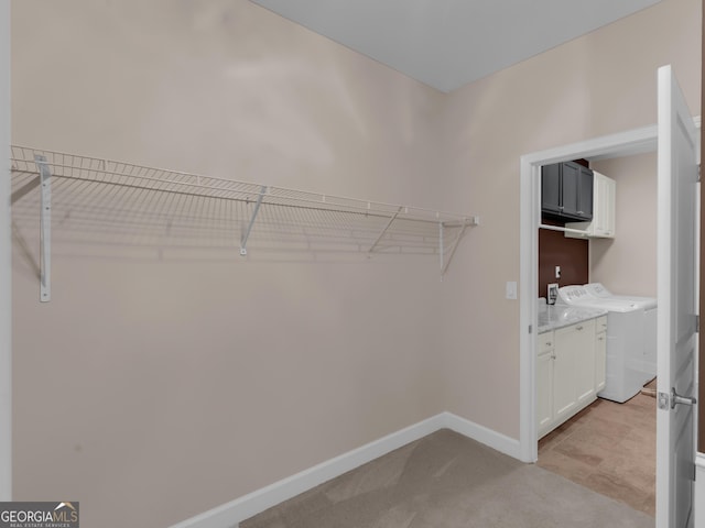 302 Burberry Ct, Griffin, GA 30223 - walk in closet with light carpet and washing machine and clothes dryer