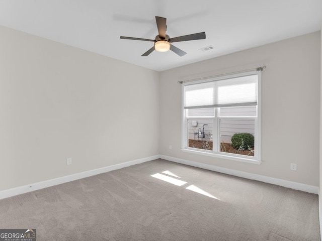 302 Burberry Ct, Griffin, GA 30223 - spare room with baseboards, carpet floors, and ceiling fan