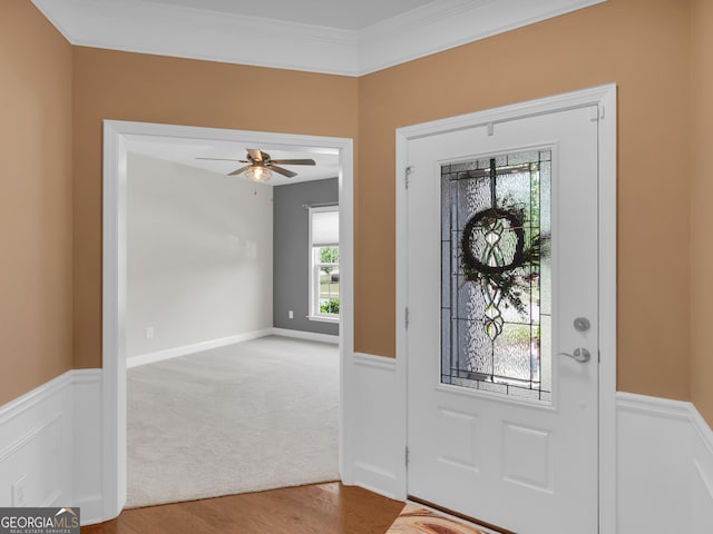 302 Burberry Ct, Griffin, GA 30223 - entrance foyer featuring a ceiling fan, wood finished floors, wainscoting, and ornamental molding