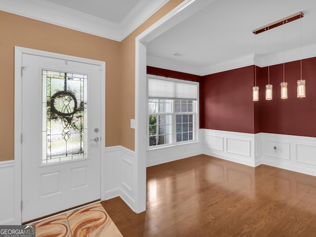 302 Burberry Ct, Griffin, GA 30223 - entrance foyer featuring a wainscoted wall, wood finished floors, a decorative wall, and crown molding