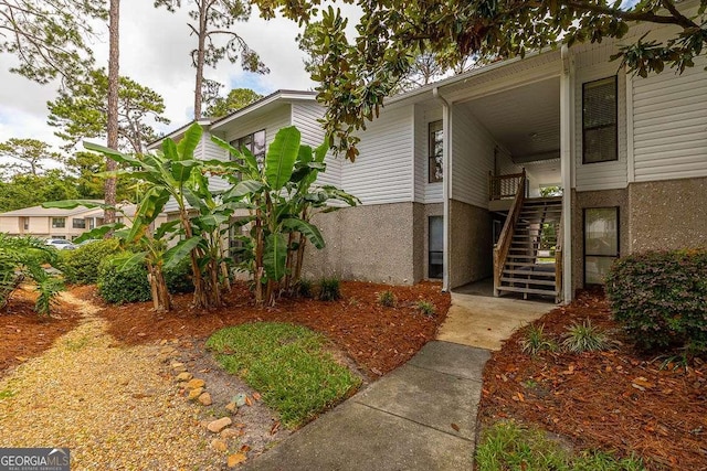 2510 Demere Rd Unit 7, Saint Simons, GA 31522 - view of property with stairway