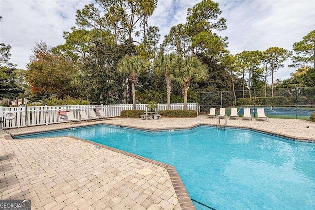 2510 Demere Rd Unit 7, Saint Simons, GA 31522 - community pool with view of wooded area and a patio