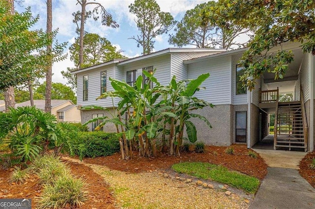 2510 Demere Rd Unit 7, Saint Simons, GA 31522 - view of front of house featuring stairs