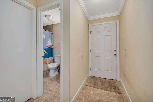 2510 Demere Rd Unit 7, Saint Simons, GA 31522 - entryway with ornamental molding, baseboards, and light tile patterned floors