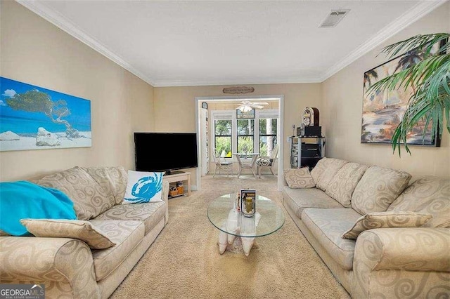 2510 Demere Rd Unit 7, Saint Simons, GA 31522 - living area featuring carpet flooring, ornamental molding, and a ceiling fan