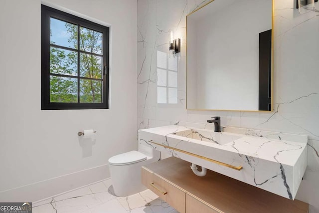 245 Traditions Dr, Alpharetta, GA 30004 - bathroom with marble finish flooring, vanity, and healthy amount of natural light