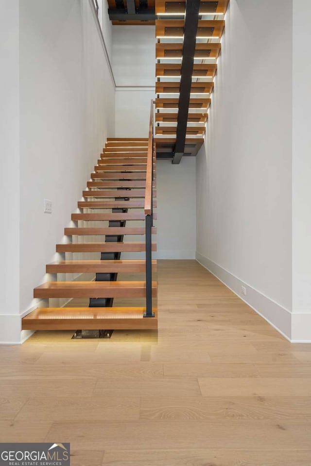 245 Traditions Dr, Alpharetta, GA 30004 - staircase featuring baseboards and wood finished floors