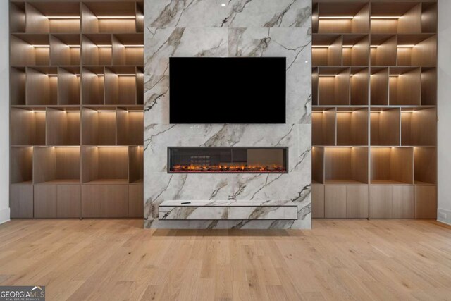 245 Traditions Dr, Alpharetta, GA 30004 - detailed view of wood finished floors and a high end fireplace