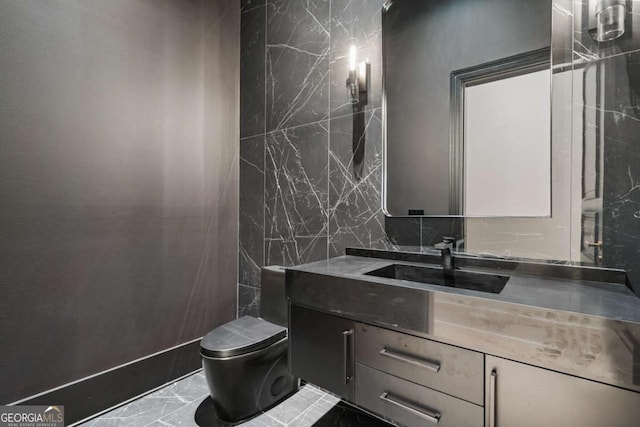 245 Traditions Dr, Alpharetta, GA 30004 - bathroom featuring vanity, marble finish floors, and tile walls