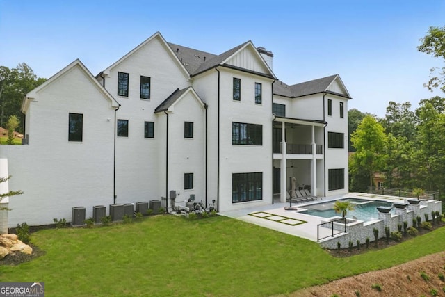 245 Traditions Dr, Alpharetta, GA 30004 - rear view of property with a balcony, a yard, a chimney, and a patio
