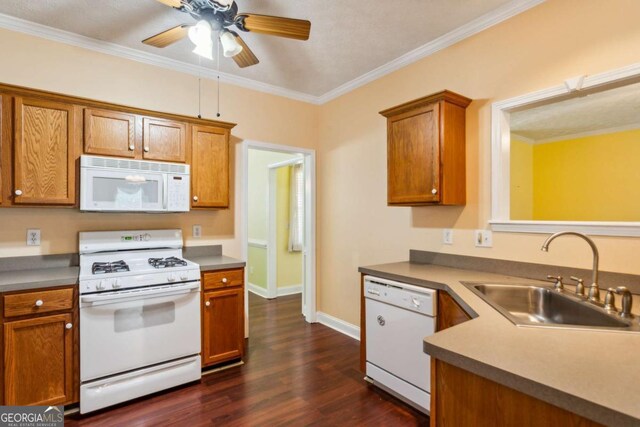 99 Rainwater Ln, Dallas, GA 30157 - kitchen featuring white appliances, dark wood-style floors, brown cabinetry, a ceiling fan, and ornamental molding