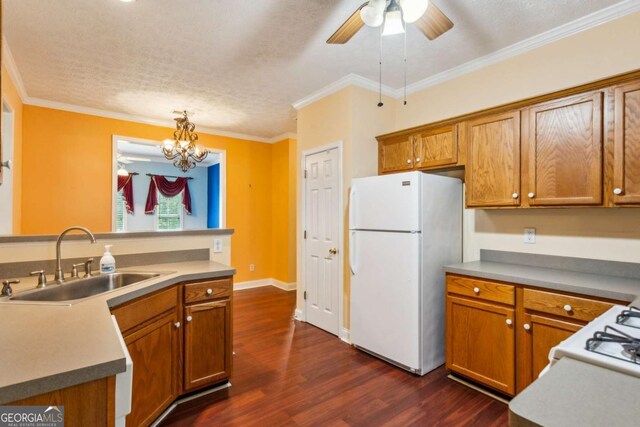 99 Rainwater Ln, Dallas, GA 30157 - kitchen featuring freestanding refrigerator, dark wood-type flooring, brown cabinets, a chandelier, and ornamental molding