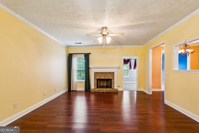 99 Rainwater Ln, Dallas, GA 30157 - unfurnished living room with plenty of natural light, wood finished floors, a ceiling fan, a textured ceiling, and crown molding