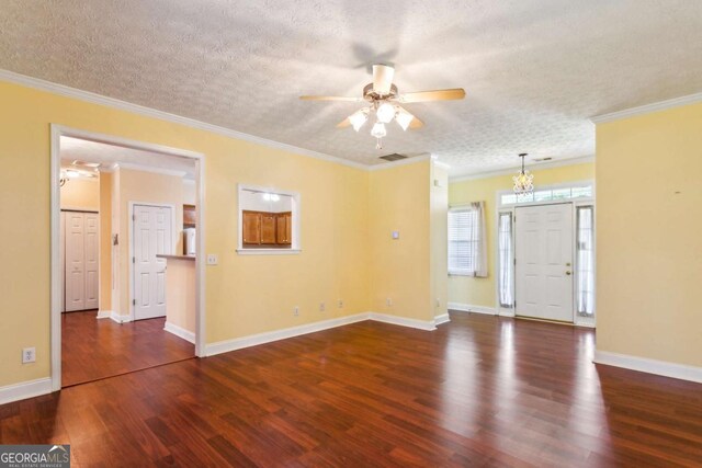 99 Rainwater Ln, Dallas, GA 30157 - unfurnished living room featuring a ceiling fan, wood finished floors, a textured ceiling, a chandelier, and crown molding