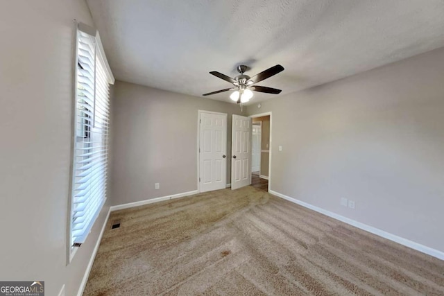 2478 Wood Meadows Dr SW, Marietta, GA 30064 - unfurnished bedroom featuring carpet and a ceiling fan
