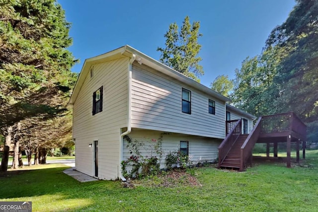 2478 Wood Meadows Dr SW, Marietta, GA 30064 - back of house with stairway, a lawn, and a deck