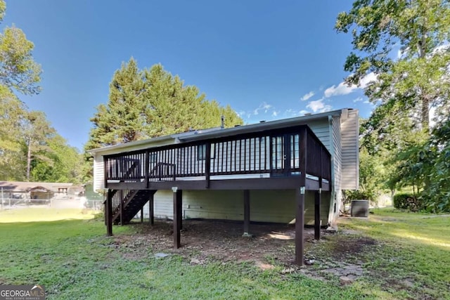 2478 Wood Meadows Dr SW, Marietta, GA 30064 - rear view of property with a deck, a lawn, and stairs