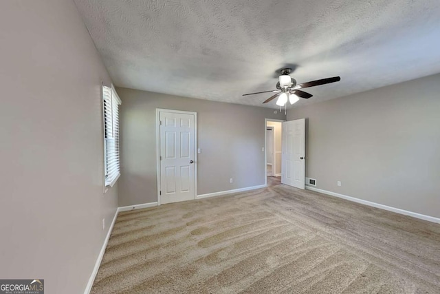 2478 Wood Meadows Dr SW, Marietta, GA 30064 - unfurnished bedroom featuring a textured ceiling, carpet flooring, and a ceiling fan