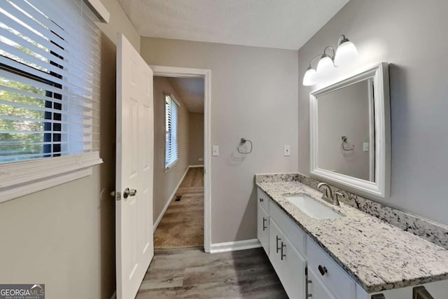 2478 Wood Meadows Dr SW, Marietta, GA 30064 - bathroom with vanity and wood finished floors