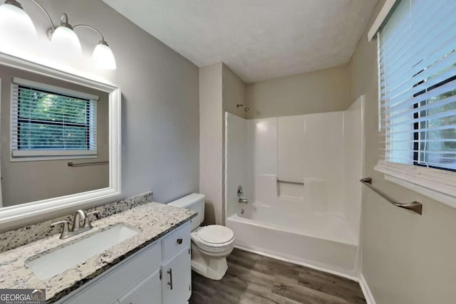 2478 Wood Meadows Dr SW, Marietta, GA 30064 - bathroom with wood finished floors, vanity, and washtub / shower combination