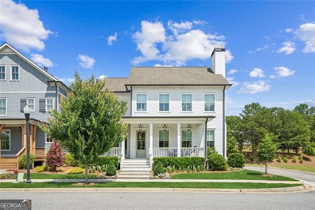 1057 Crossroads Trl, Milton, GA 30004 - view of front facade featuring a porch and a chimney