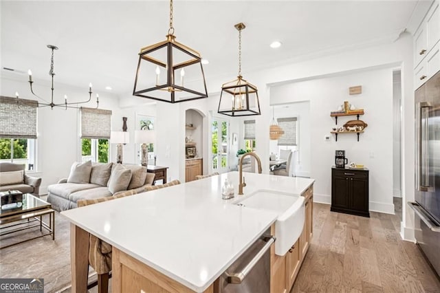 1057 Crossroads Trl, Milton, GA 30004 - kitchen with a chandelier, recessed lighting, stainless steel appliances, light wood finished floors, and light countertops
