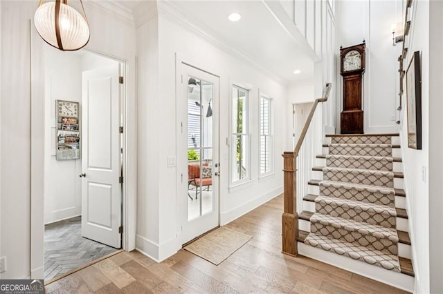 1057 Crossroads Trl, Milton, GA 30004 - entrance foyer with crown molding, light wood-style floors, stairs, and recessed lighting