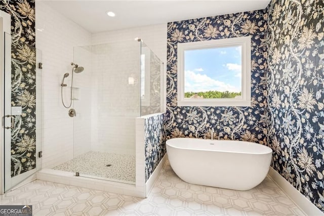1057 Crossroads Trl, Milton, GA 30004 - bathroom featuring a freestanding bath, a stall shower, and wallpapered walls