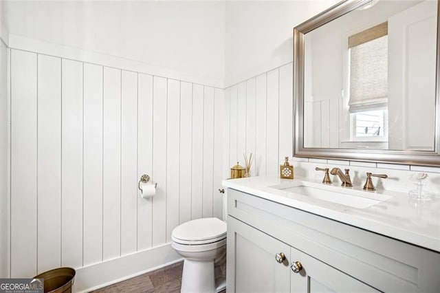 1057 Crossroads Trl, Milton, GA 30004 - half bath featuring vanity and a wainscoted wall