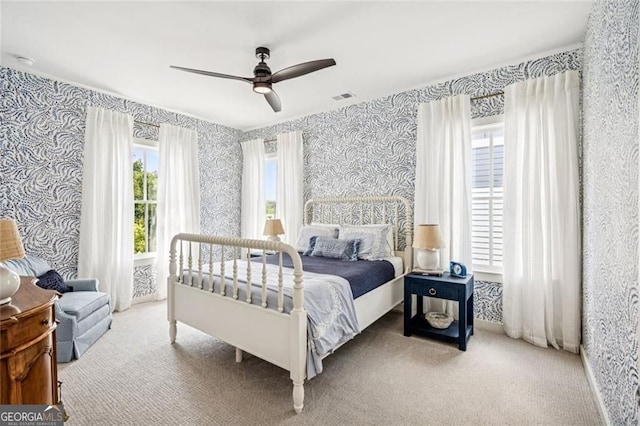 1057 Crossroads Trl, Milton, GA 30004 - bedroom featuring wallpapered walls, multiple windows, carpet floors, and a ceiling fan