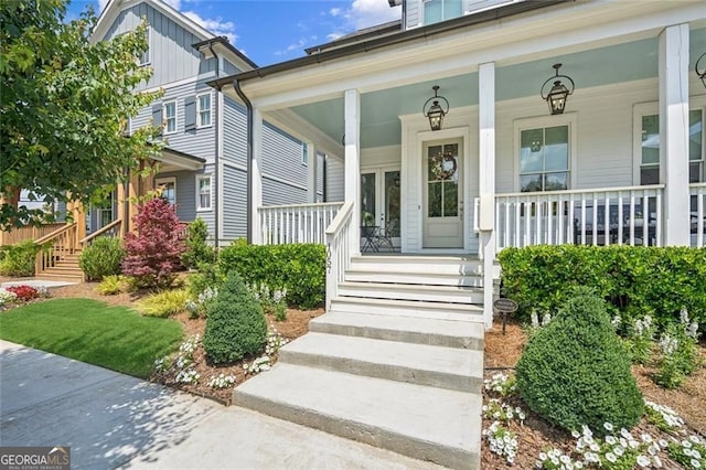 1057 Crossroads Trl, Milton, GA 30004 - property entrance featuring a porch and board and batten siding