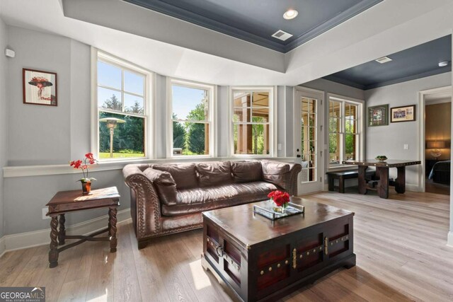 15815 Winterfield Way, Alpharetta, GA 30004 - living area featuring plenty of natural light, ornamental molding, wood finished floors, a raised ceiling, and recessed lighting