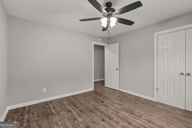 1000 Jones Rd, Cataula, GA 31804 - unfurnished bedroom with wood finished floors, baseboards, ceiling fan, and a closet