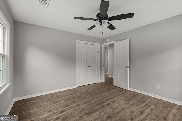 1000 Jones Rd, Cataula, GA 31804 - unfurnished bedroom featuring wood finished floors, a closet, and baseboards