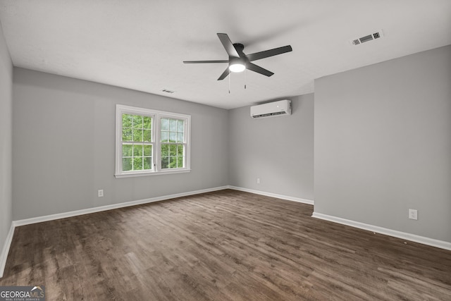 1000 Jones Rd, Cataula, GA 31804 - unfurnished room with an AC wall unit, dark wood-style flooring, a ceiling fan, and baseboards
