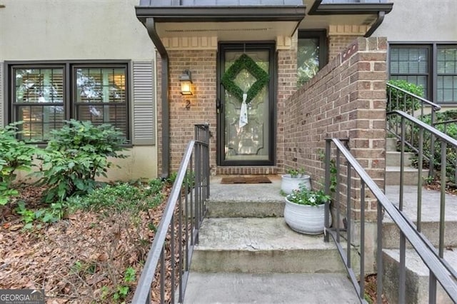 2 Arpege Way NW, Atlanta, GA 30327 - doorway to property featuring brick siding and stucco siding